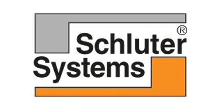 The Schluter Systems logo features black text overlaid by a gray and orange geometric design forming a right angle—a familiar sight for many phoenix bathroom contractors seeking quality installation materials.